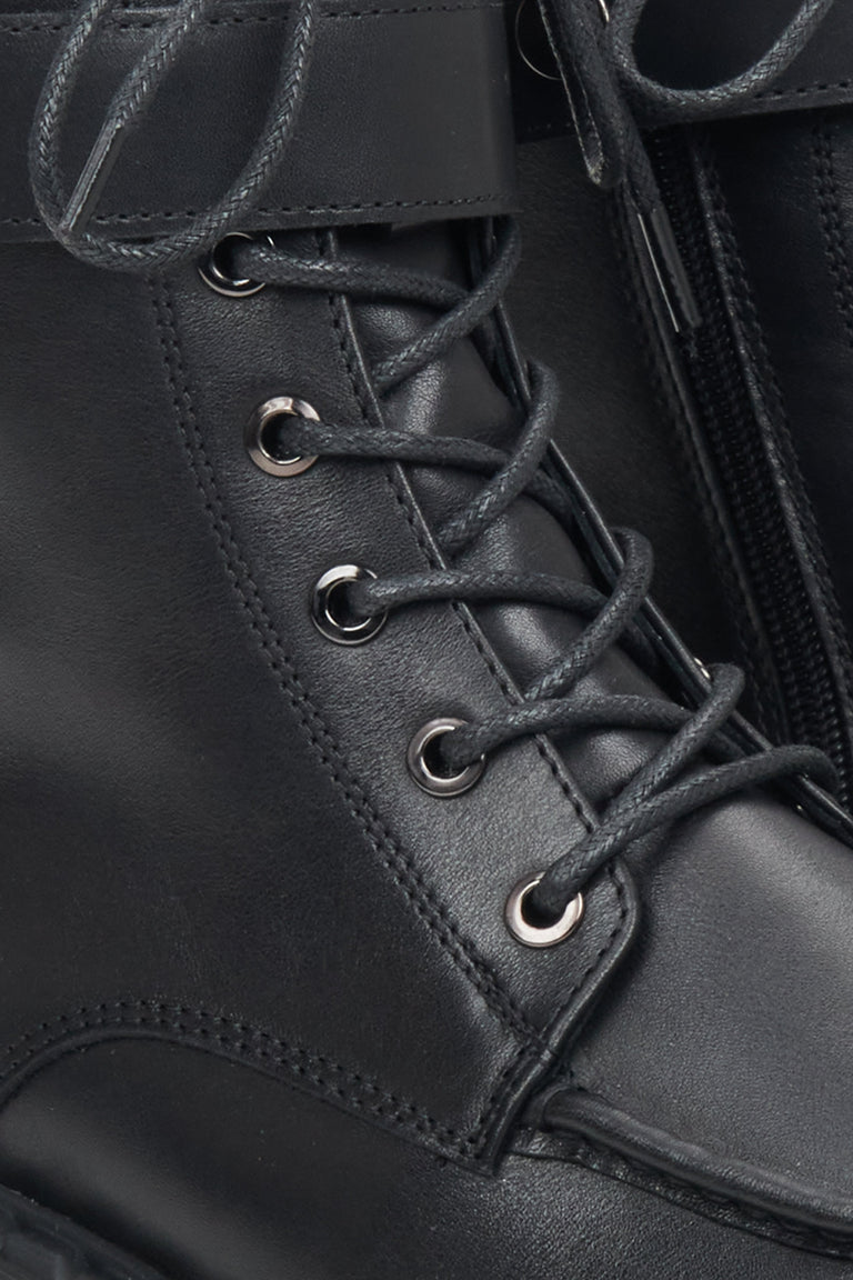 Women's black leather Estro combat boots - close-up on the decorative lacing system.