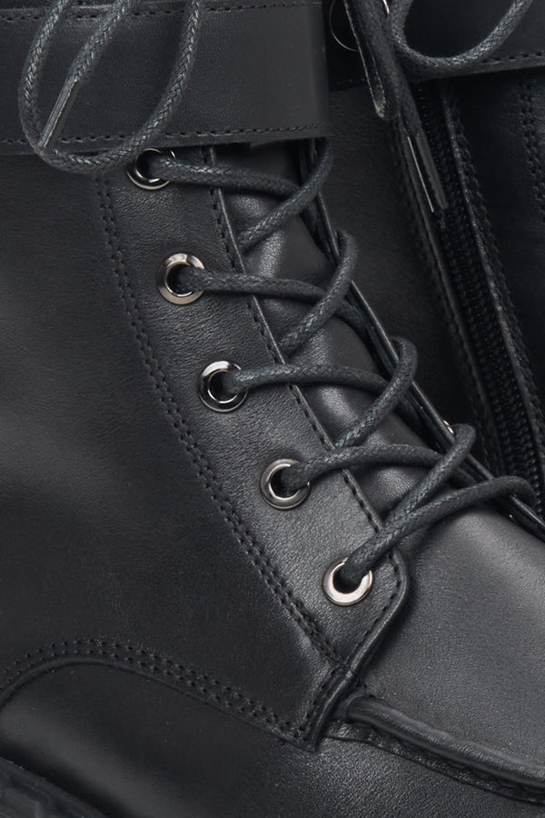 Women's black leather Estro combat boots - close-up on the decorative lacing system.