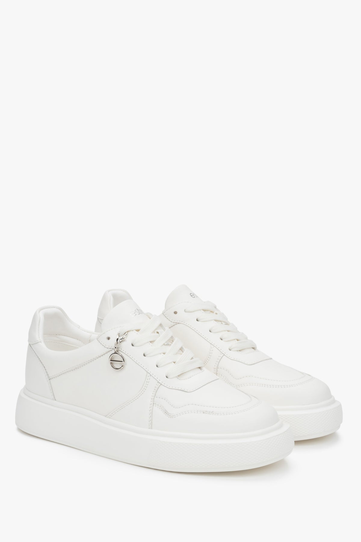 Stylish white Estro women's sneakers, made of natural leather and set on a flexible, comfortable sole.