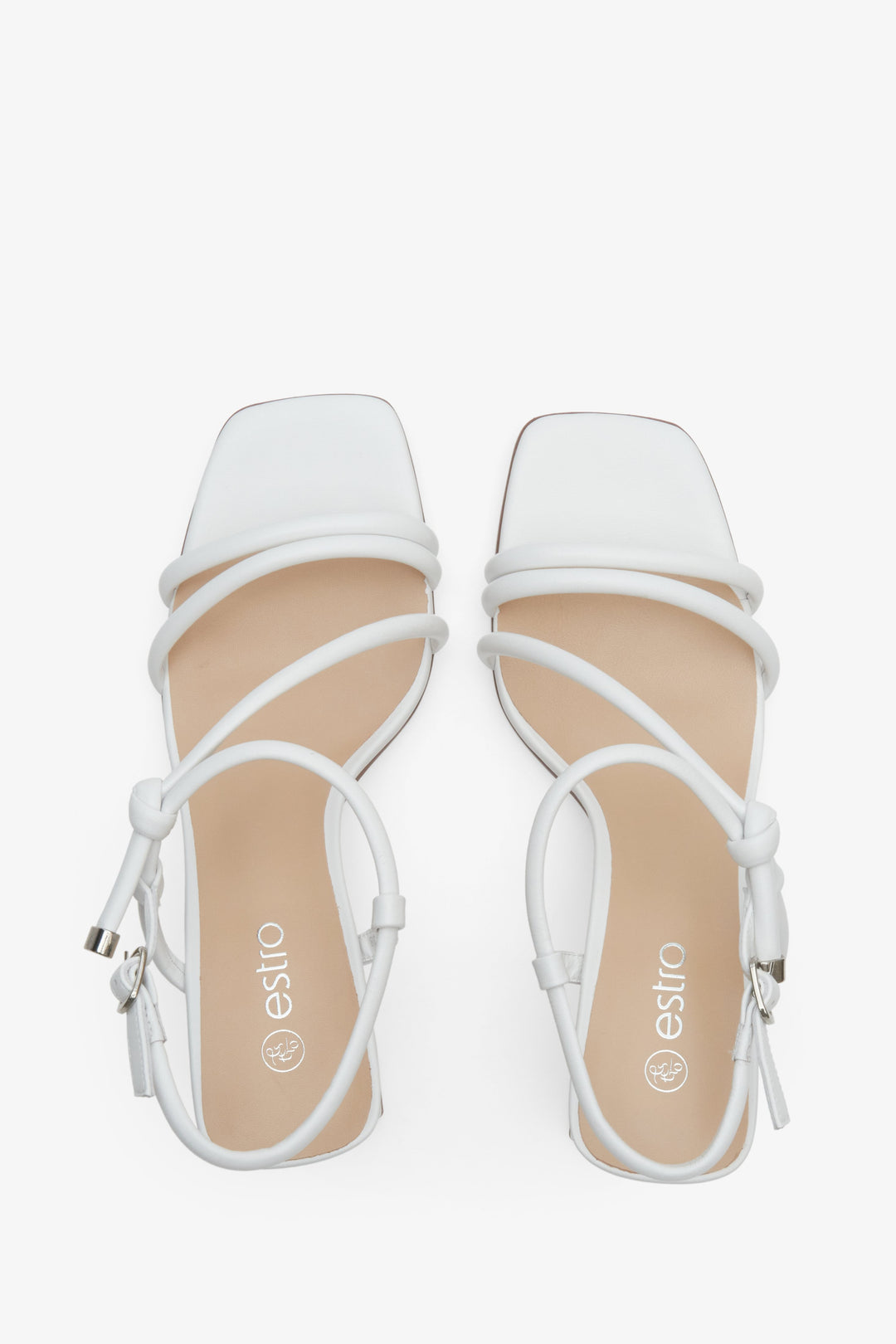 White leather women's sandals with a stable heel presentation of the footwear from above - presentation of a shoe toe and sideline.