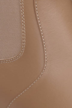 Women's brown  leather ankle boots for autumn by Estro - close-up on the details.