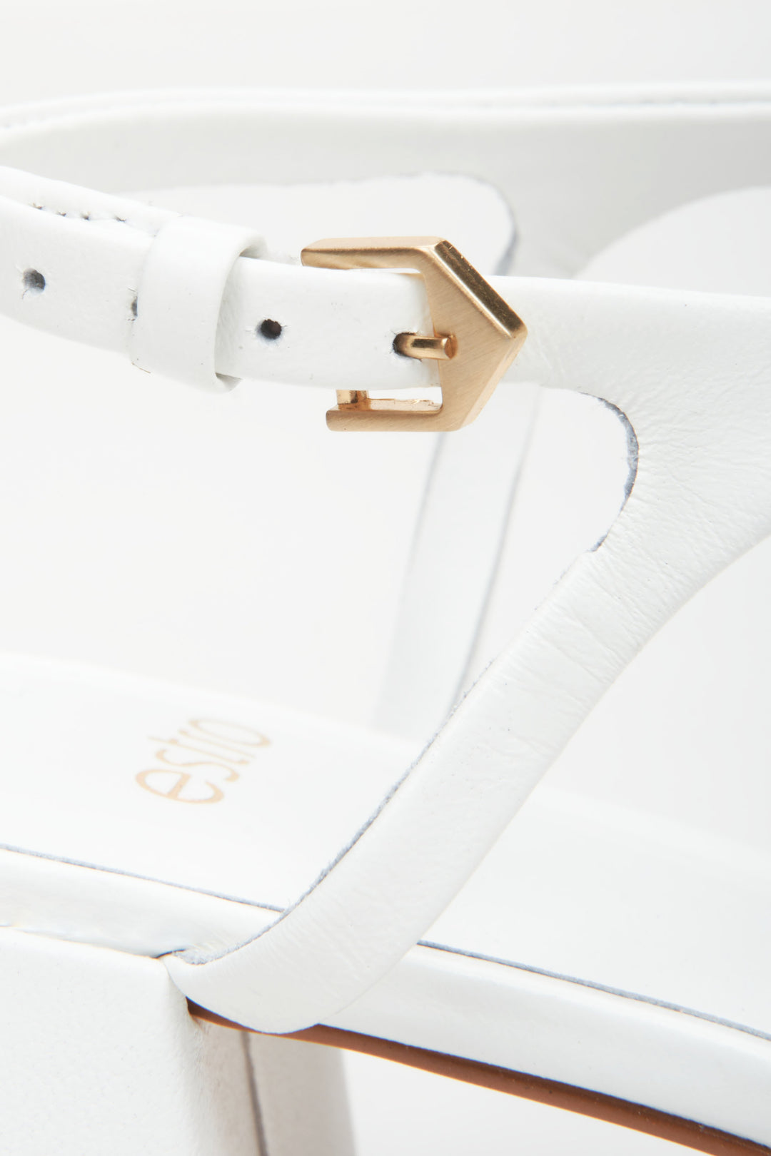 Women's white sandals made of genuine leather by Estro - close-up on details.