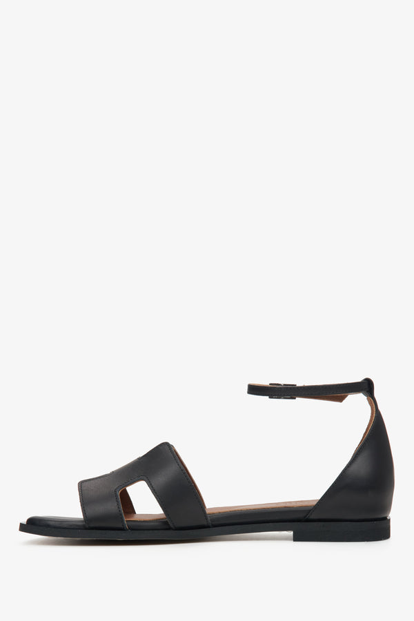 Women's black sandals - side view.