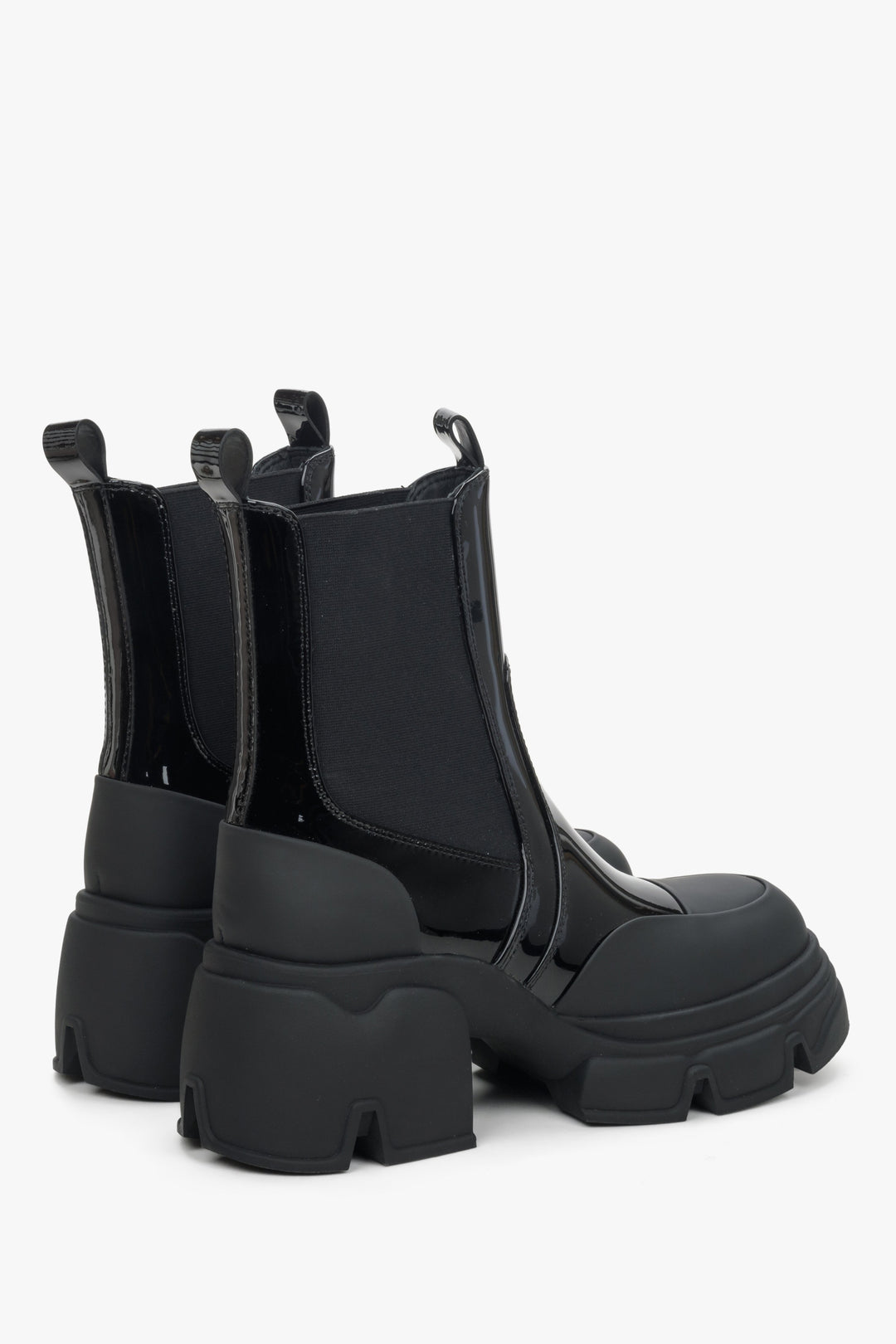 Women's black Chelsea boots made of patent genuine leather by Estro - close-up on the side line and heel counters of the shoe.