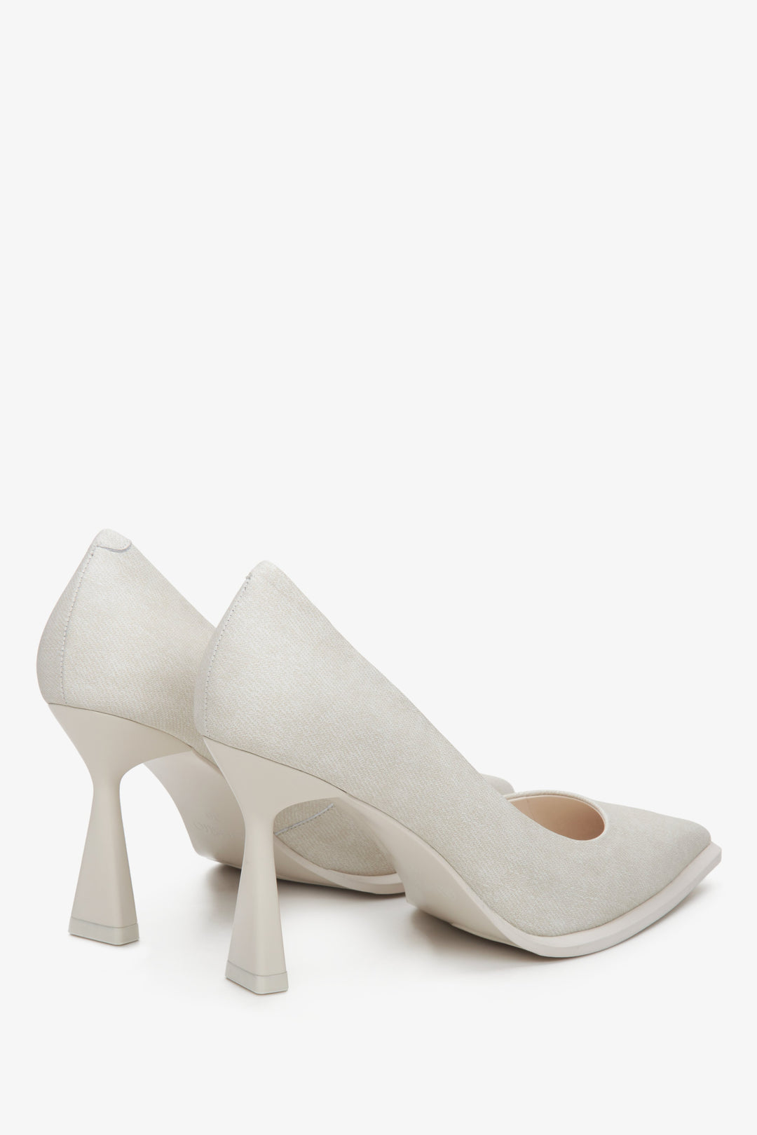 Women's light beige denim pumps by Estro - close-up on the heel and side line of the shoes.