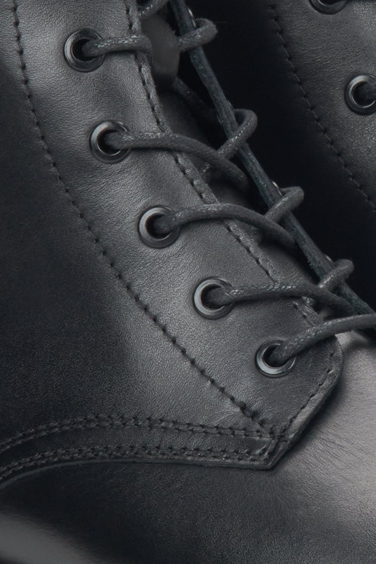Women's black leather ankle boots by Estro - close-up of the details.