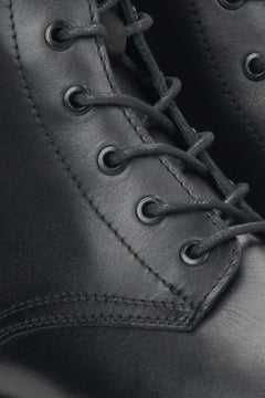 Women's black leather ankle boots by Estro - close-up of the details.