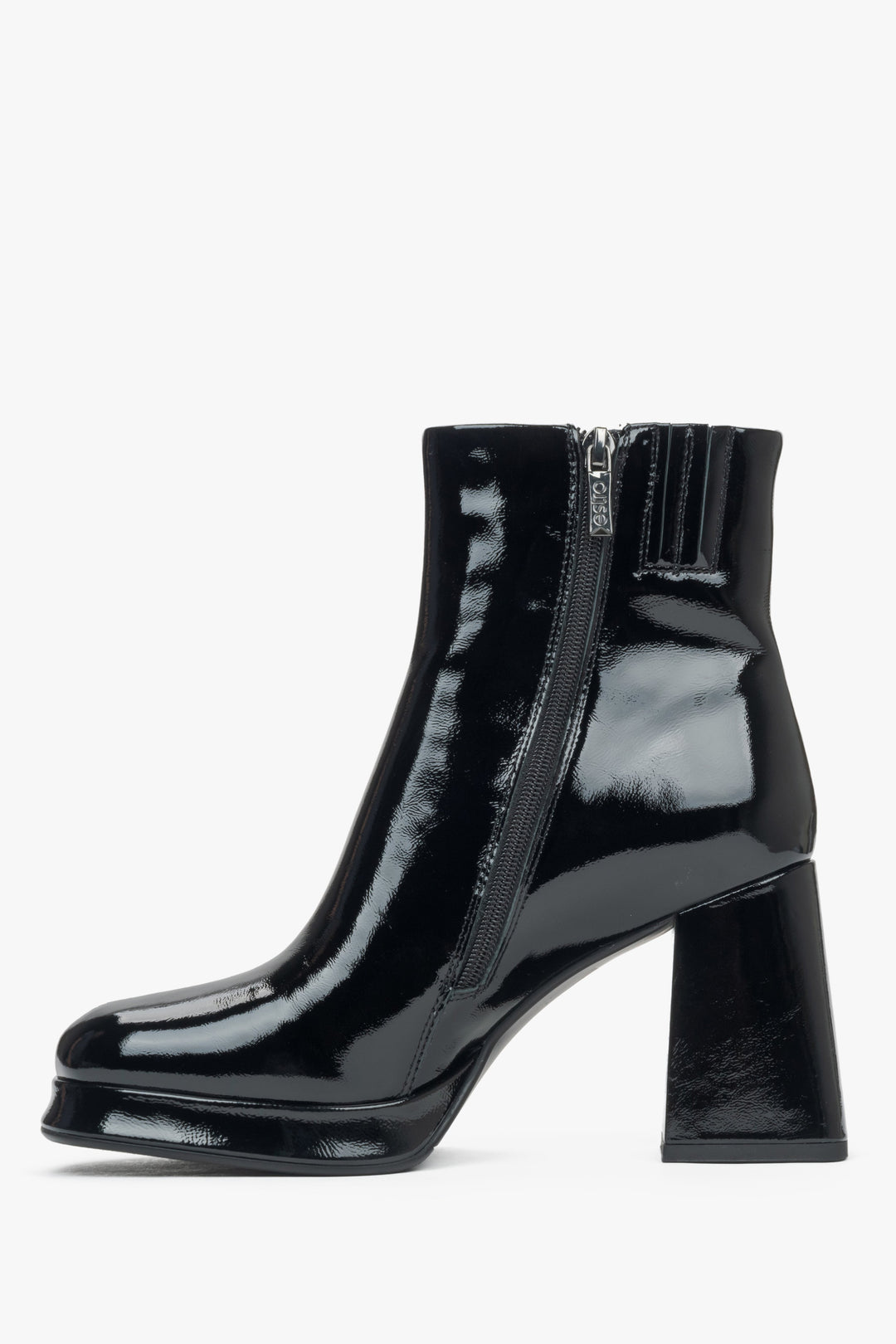 Black patent leather women's ankle boots on a platform with a stable heel by Estro - side profile of the shoe.