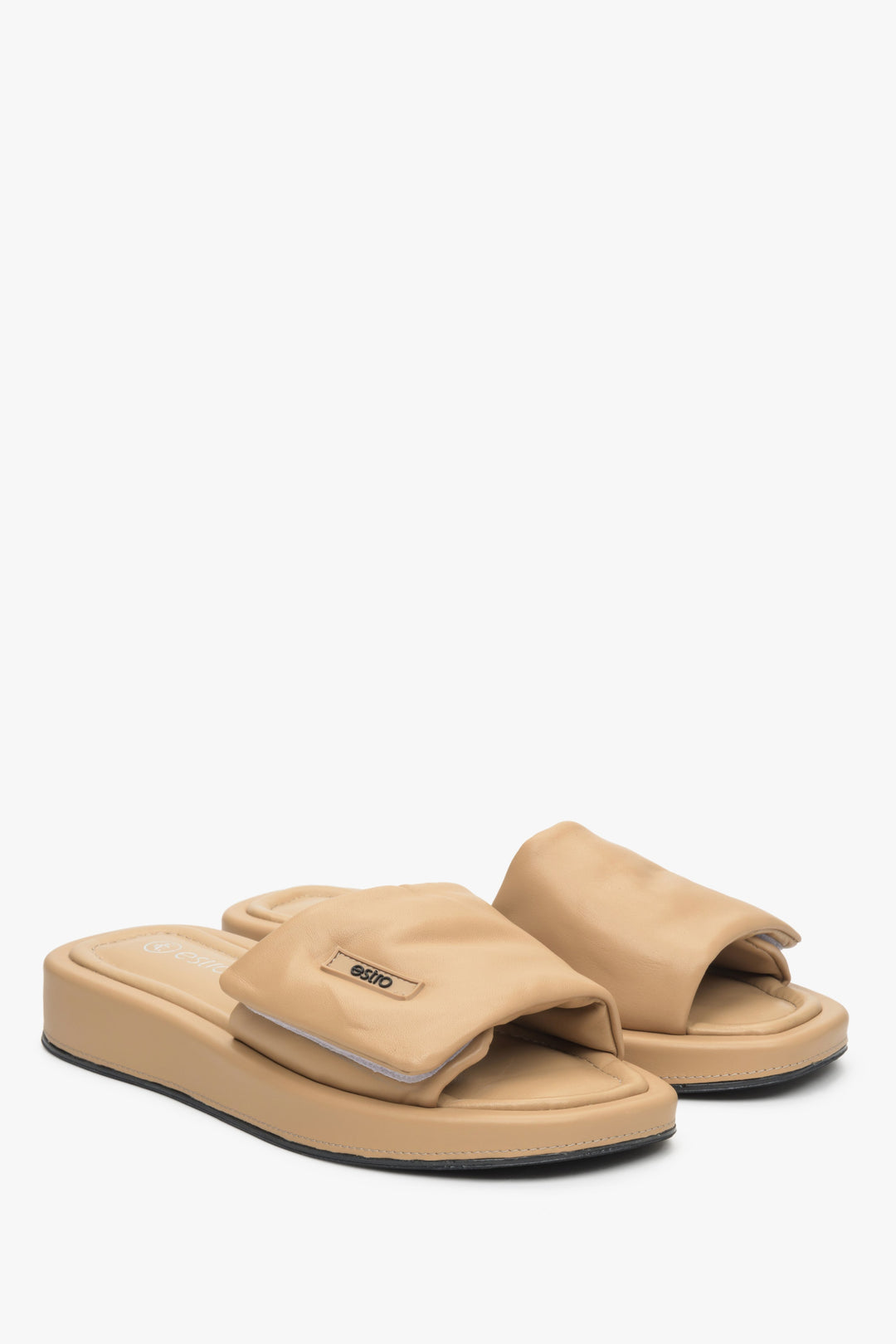 Women's leather slide sandals by Estro in beige.