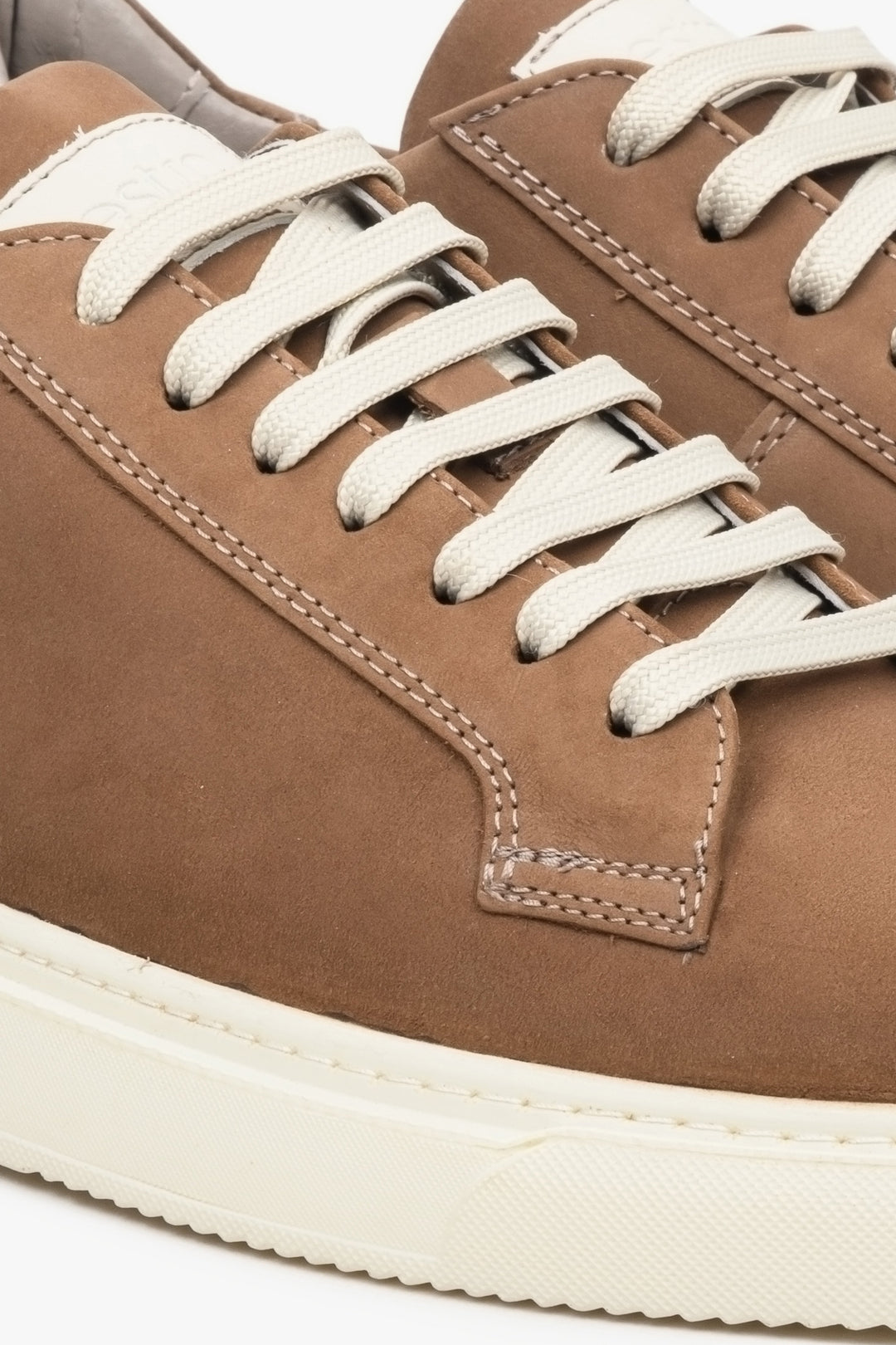 Men's brown nubuck sneakers for spring - a close-up of the sewing system.
