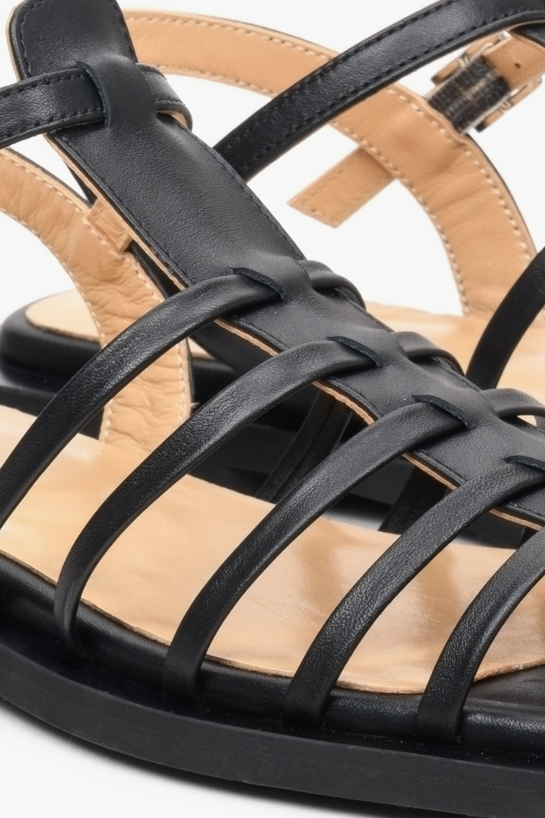 Women's sandals for summer in black natural leather - close-up on details.