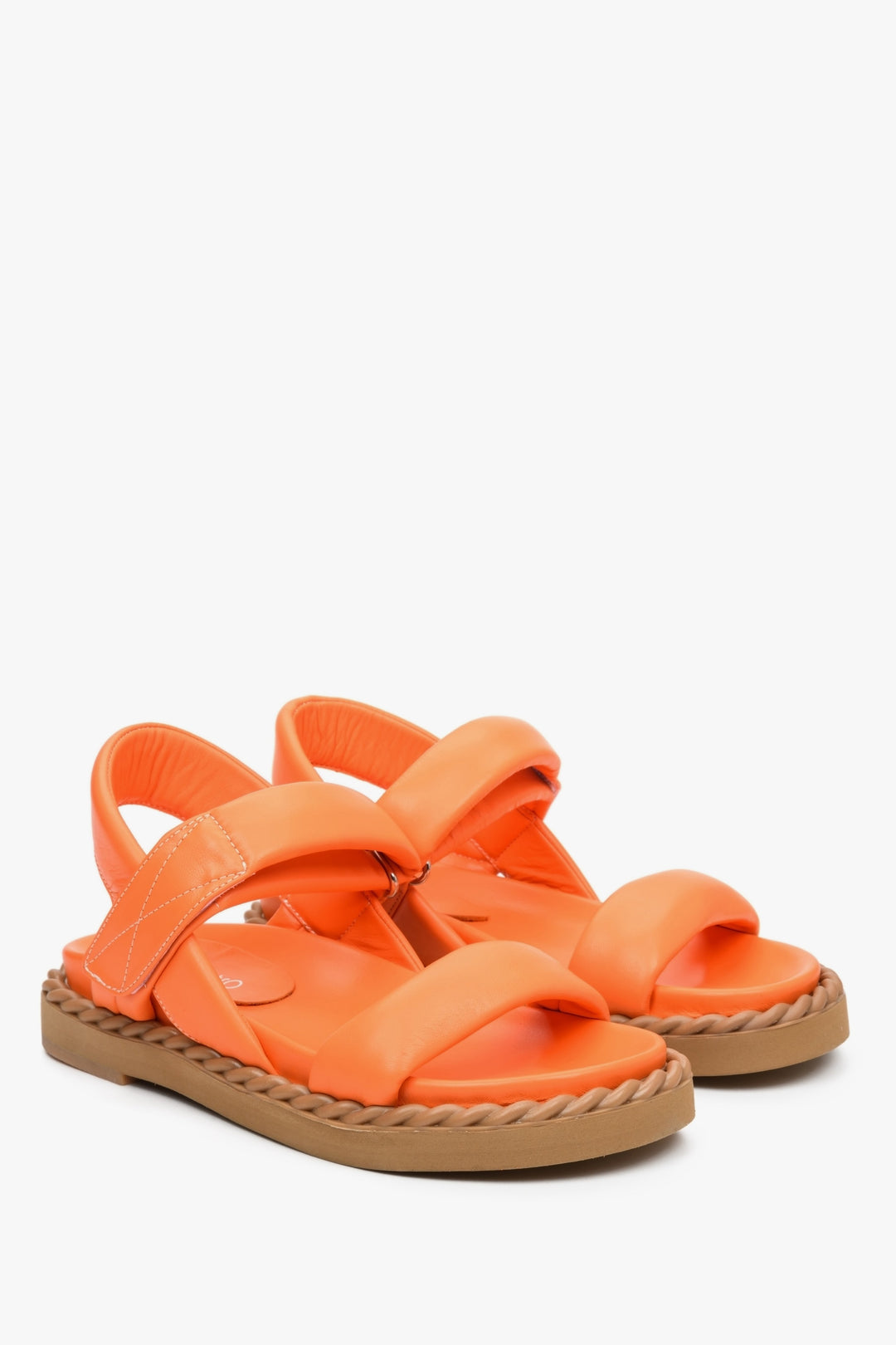 Women's sandals for summer in orange colour made of natural leather on a comfortable sole.