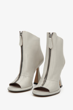 Women's heeled ankle boots made of natural leather in gray with an open toe.