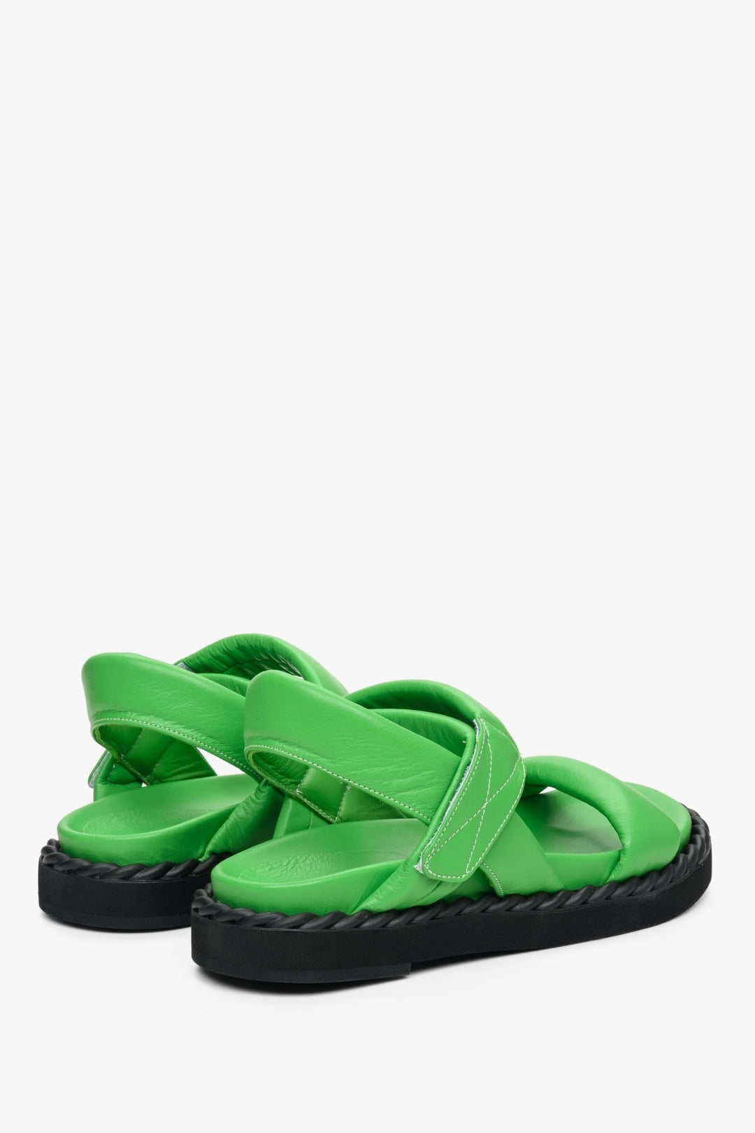 Women's green flat sandals for summer on a comfortable, flexible sole - the presentation of the back and side of the shoes.
