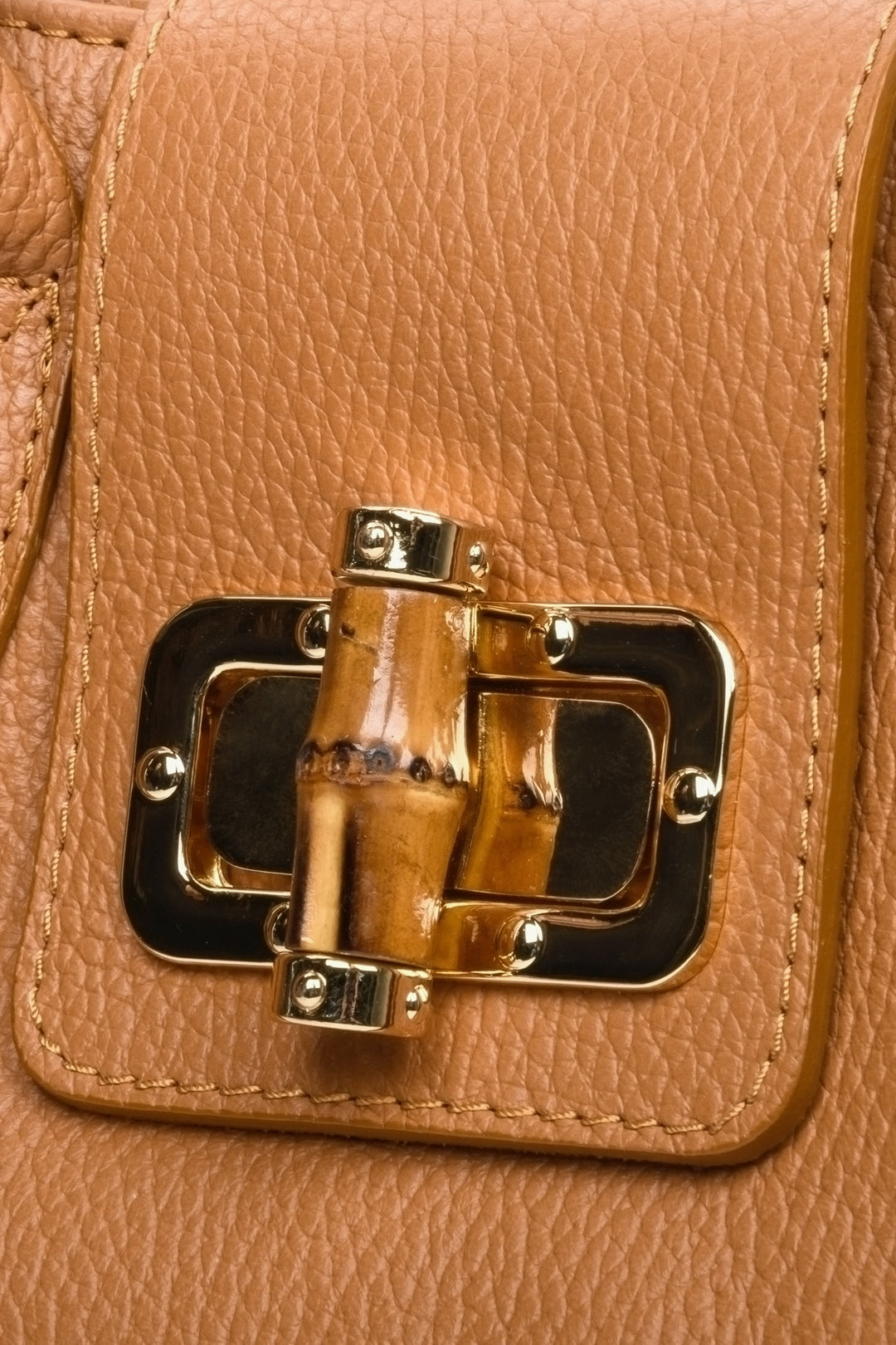 Brown leather handbag of Italian production. Close-up of the details.