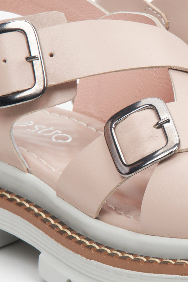 Women's pastel pink leather sandals - a close-up of the fastening and support system.