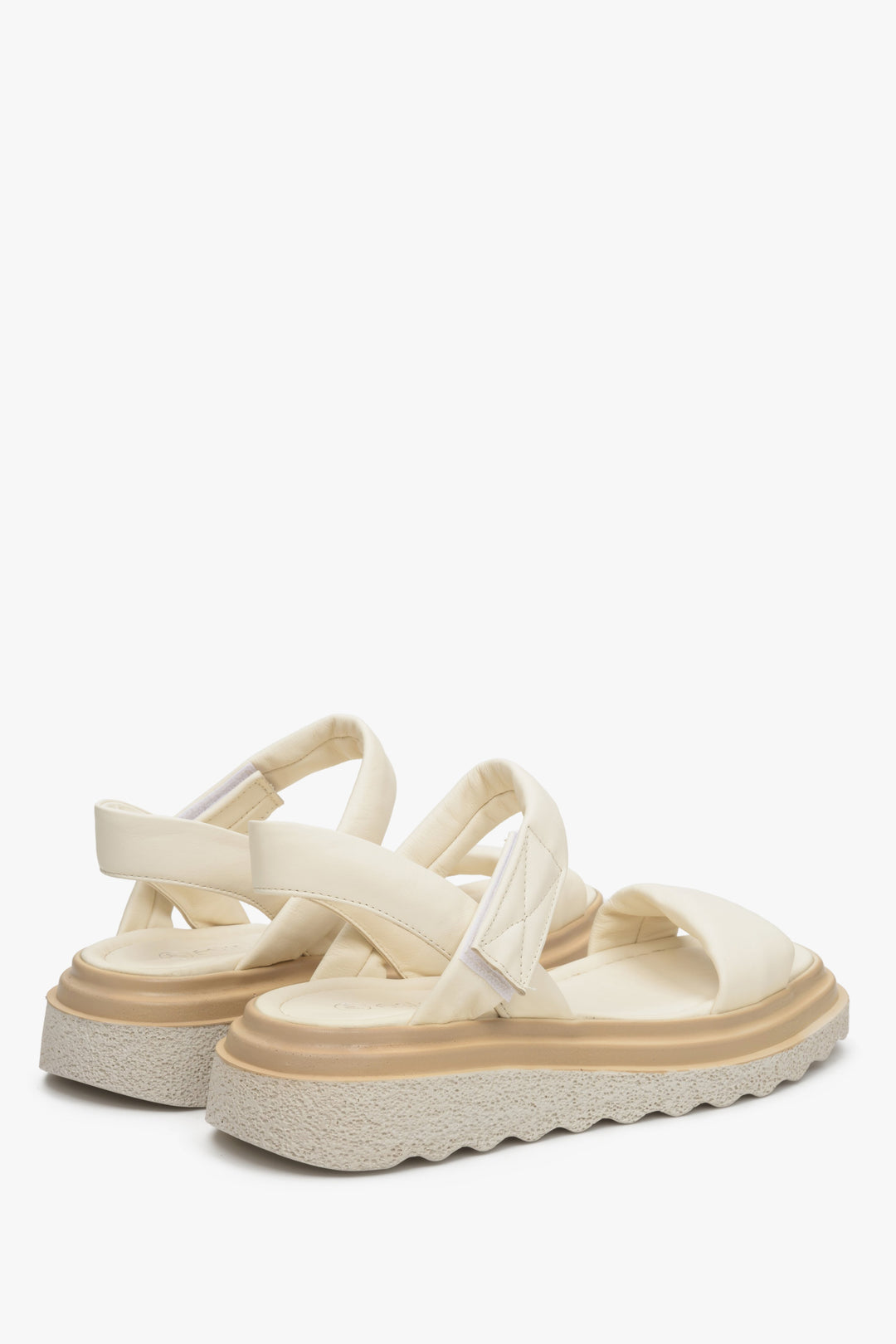 Women's light beige leather sandals with hook-and-loop fastening on an elastic platform - presentation of the model at the back.
