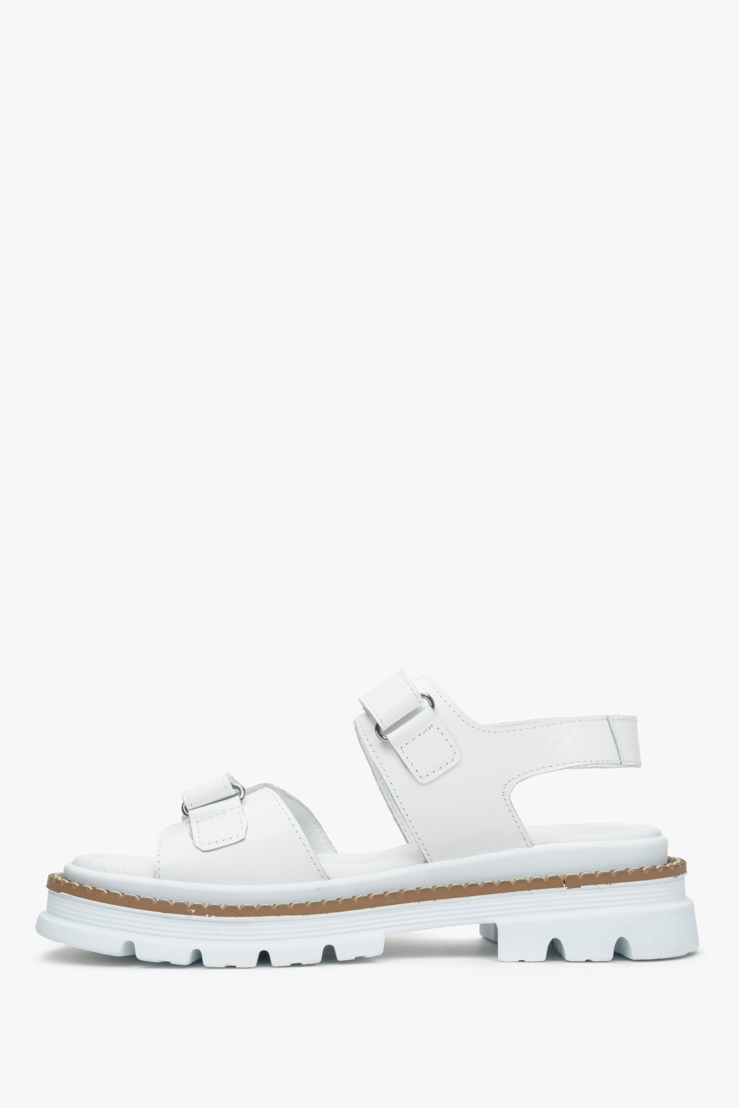 White women's sandals with thick straps on a massive platform Estro - shoe profile.