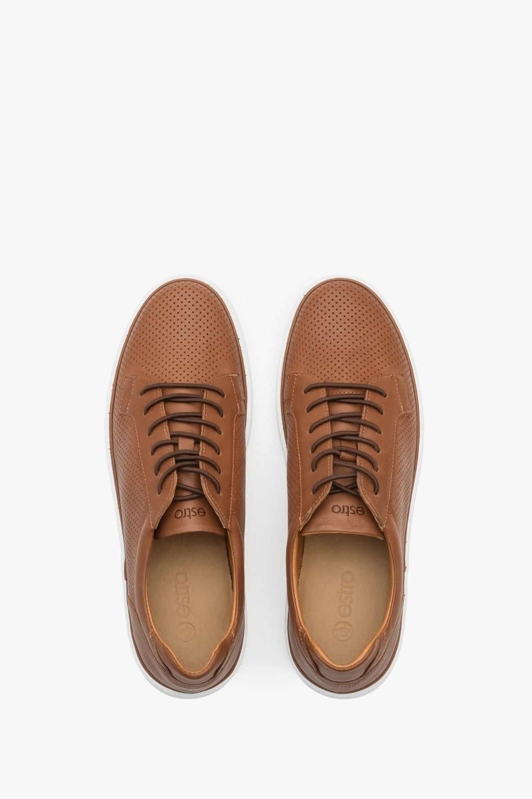 Men's leather sneakers for summer in brown color with perforation - presentation of shoes from above.