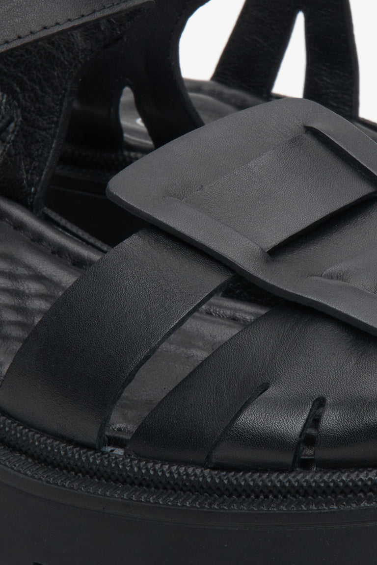 Women's black sandals on a chunky platform Estro - close up on details.
