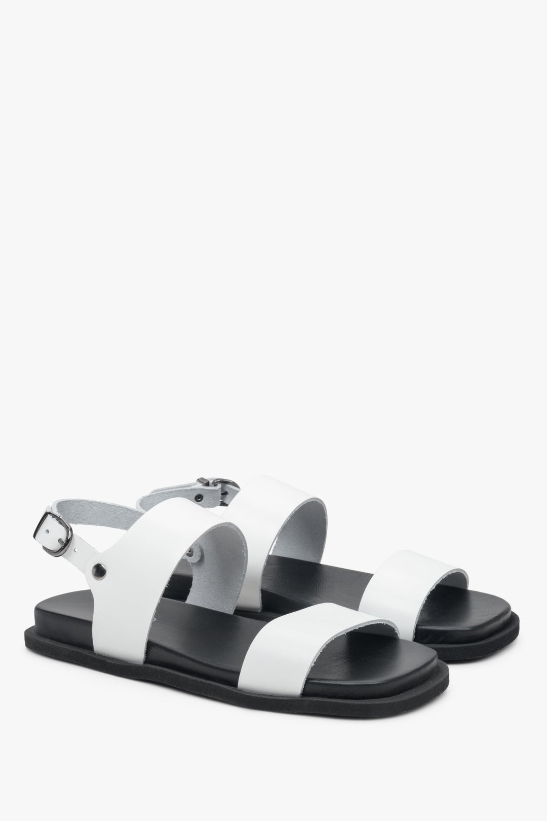 Women's white sandals on a black flat sole made of natural leather Estro.