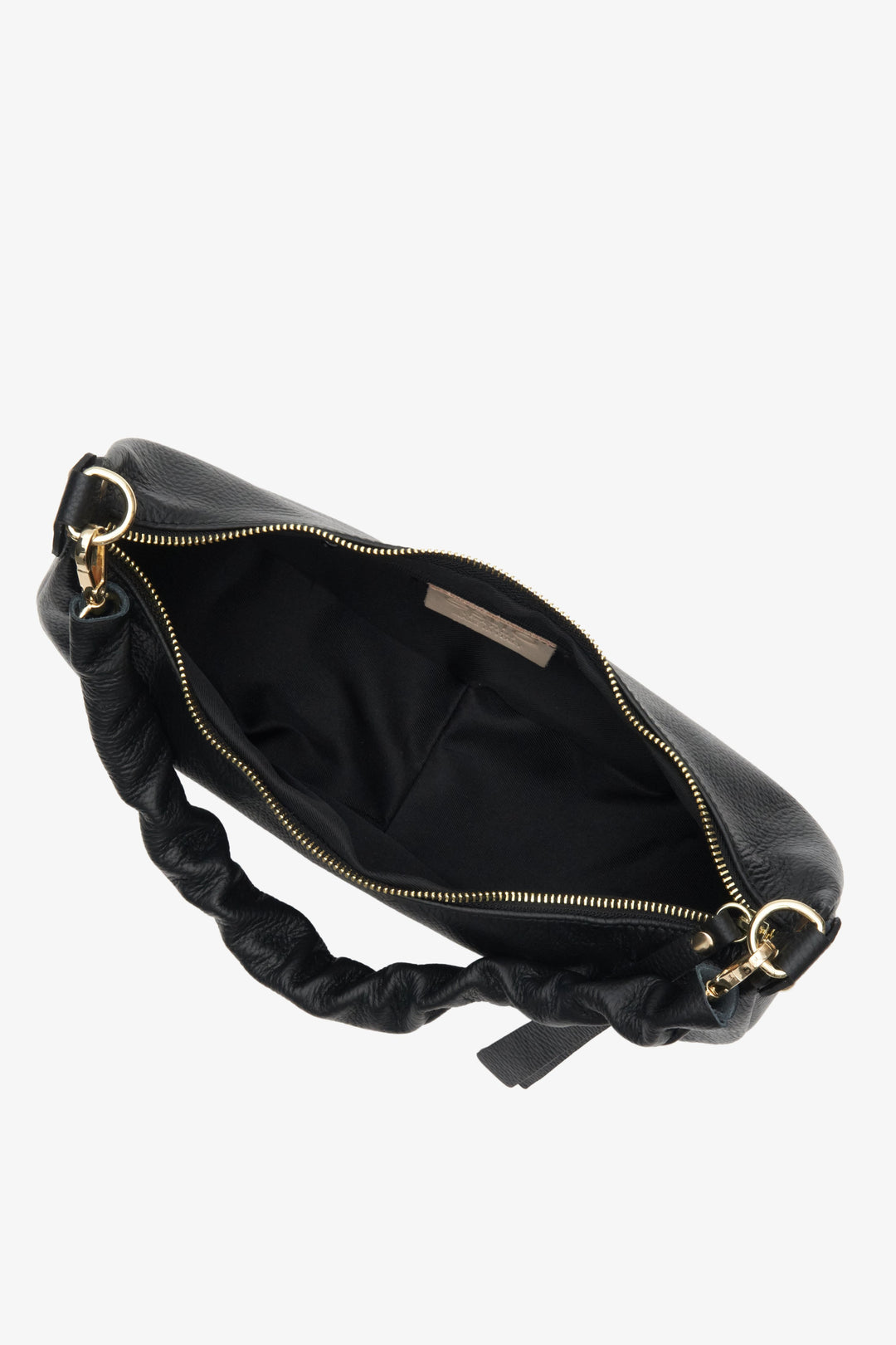 Stylish black half-moon shoulder bag fastened with a zip - close-up on the lining.