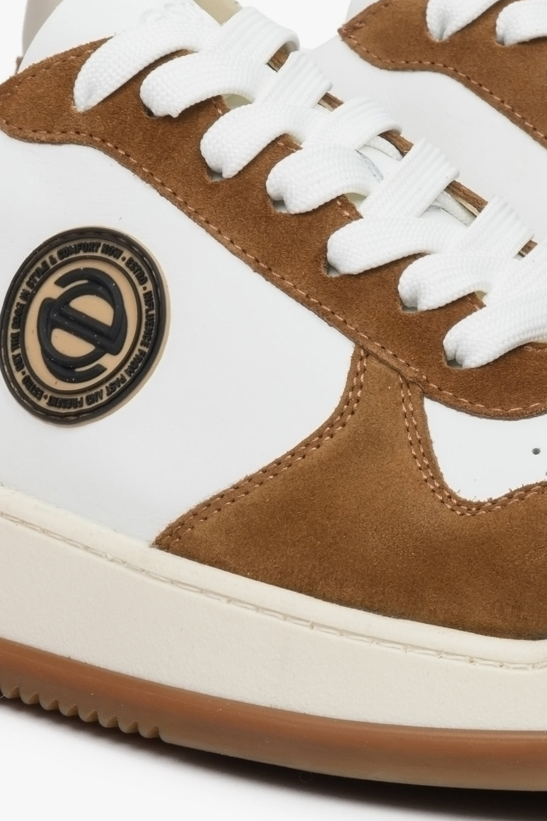 Men's sneakers in suede and leather, brown and white - close-up of details.