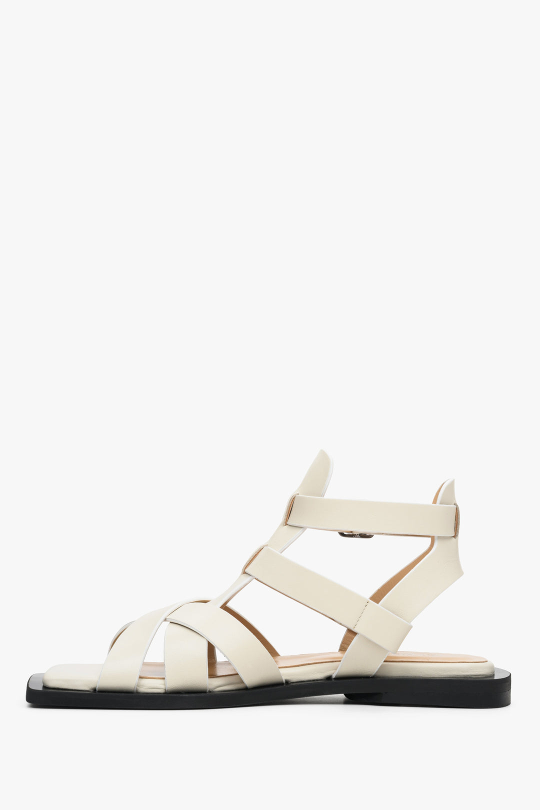 Women's leather sandals with thin straps on a flat heel Estro - shoe profile in white.