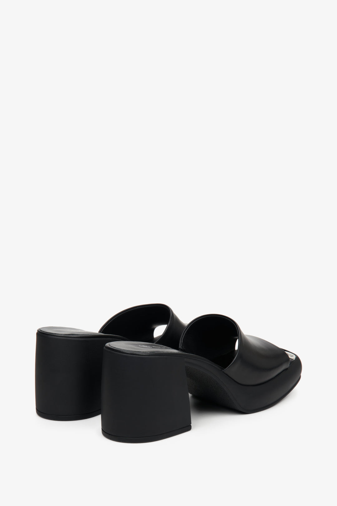Women's black mules with a square heel - a close-up of the back of the shoes.