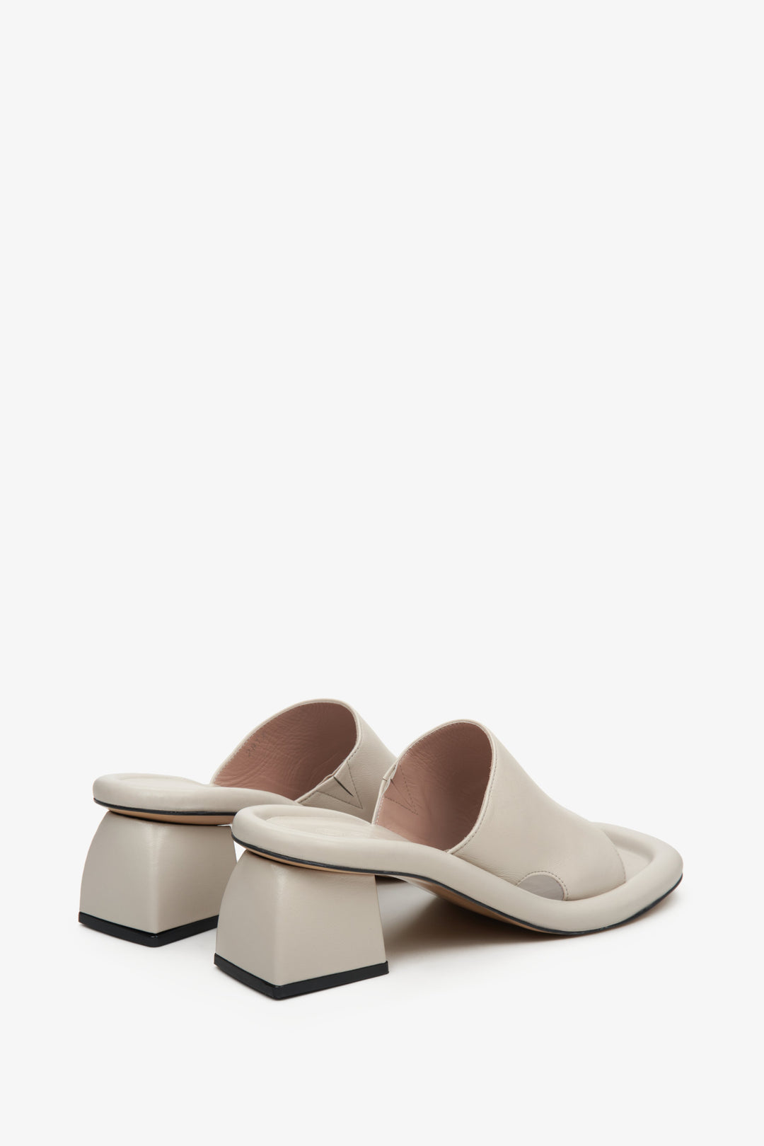 Women's beige mules with a square heel - a close-up of the back of the shoes.