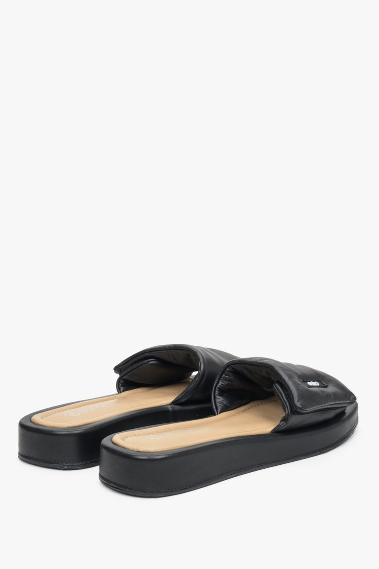 Leather slide sandals by Estro in black.
