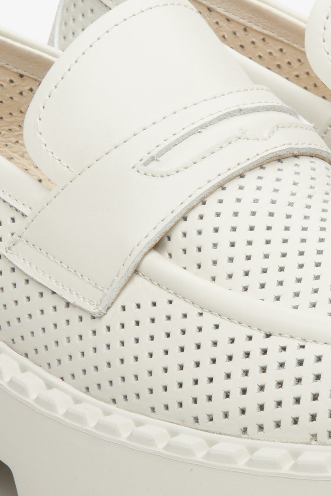 Women's leather loafers for summer in light beige color, brand Estro - close-up on the stitching system and perforation.