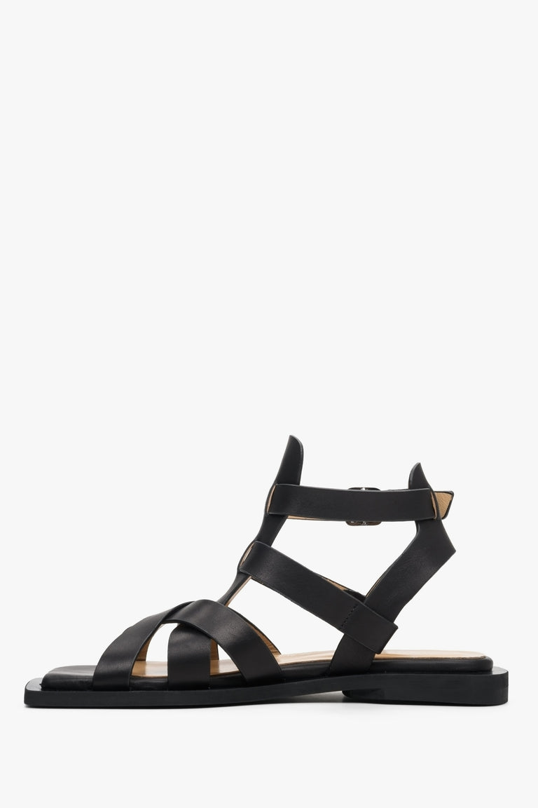 Women's leather sandals with thin straps on a flat heel Estro - shoe profile in black.