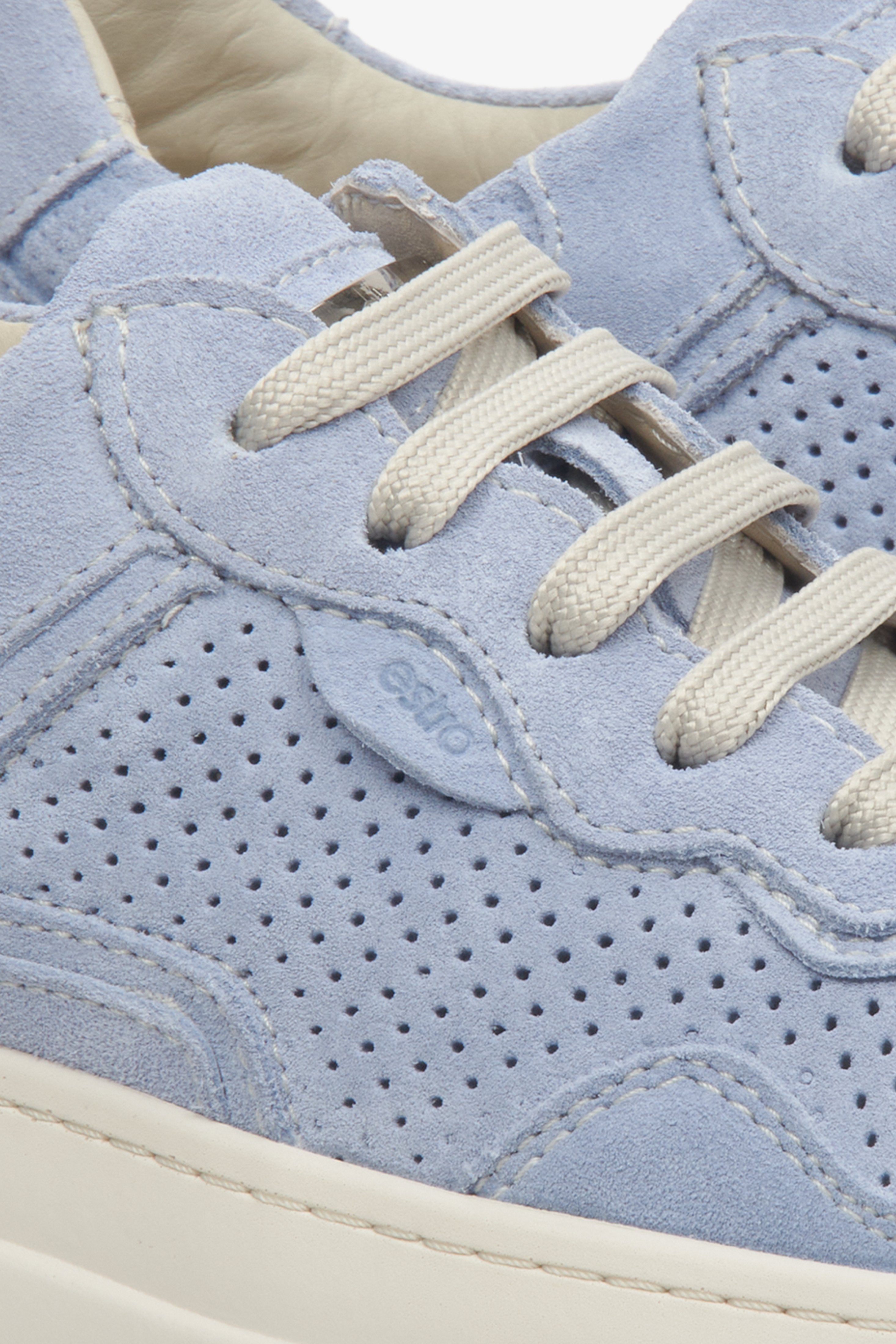 Estro women's suede sneakers in light blue with perforations for summer - close-up on details.