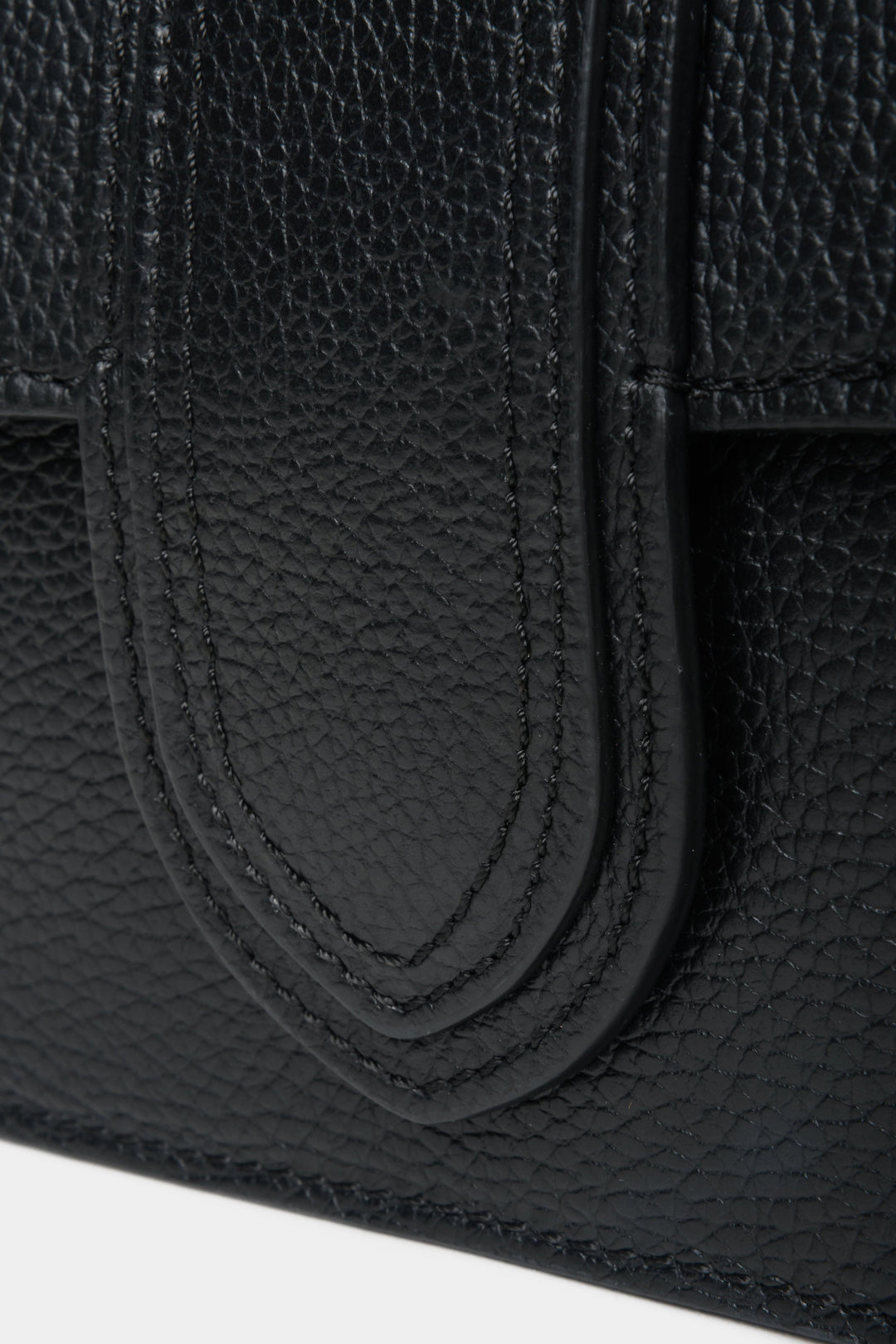 Black Estro women's leather handbag - close-up of decorative clasp.