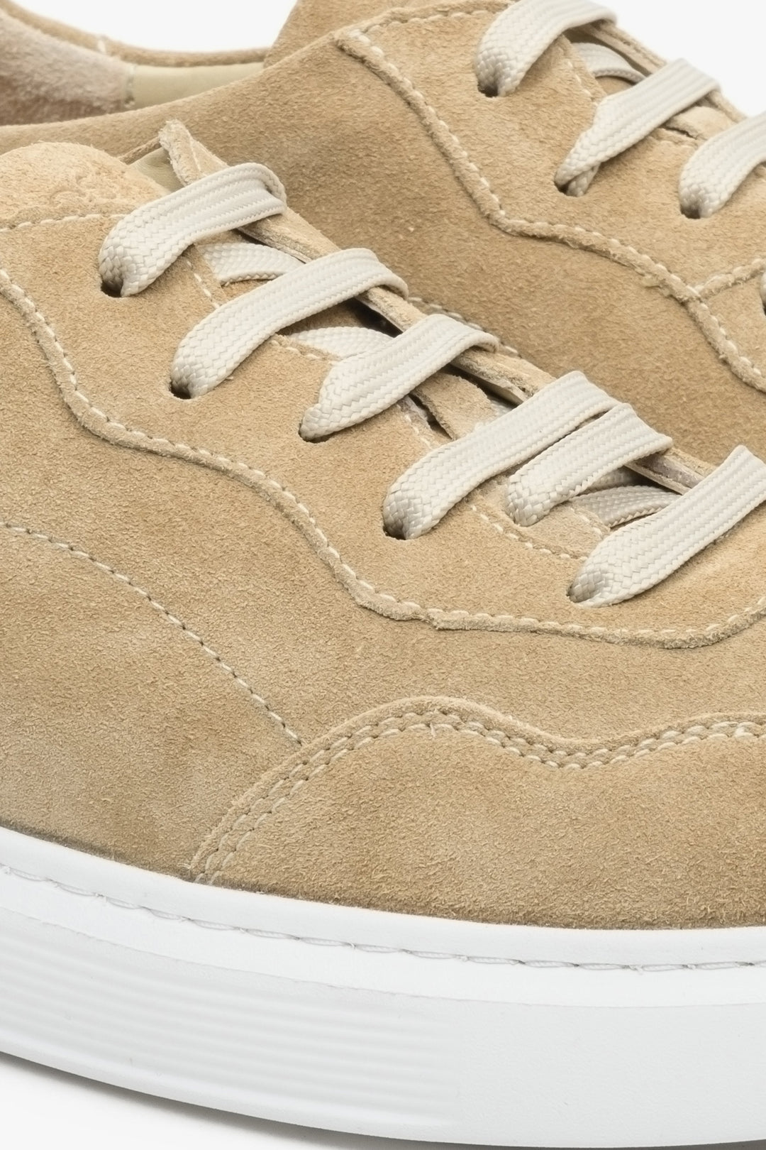 Sand beige velour men's sneakers with lacing - close-up of the stitching system.